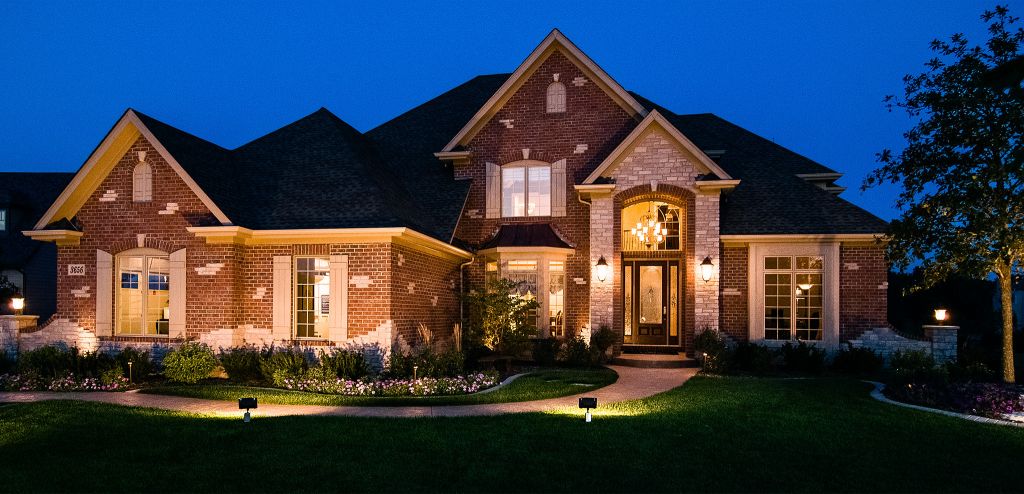 lighted house exterior at dusk