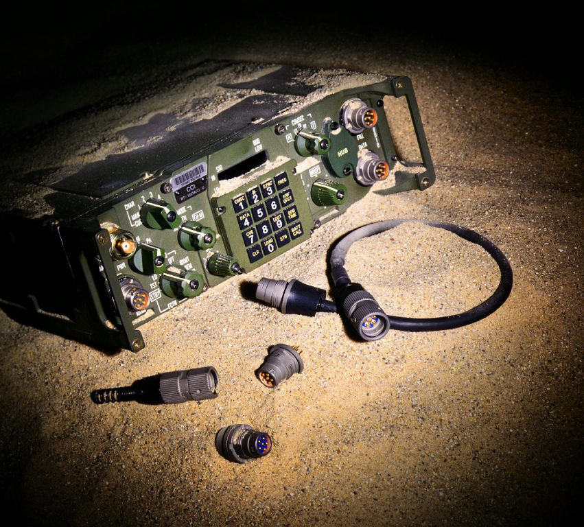 military radio in sand product photo