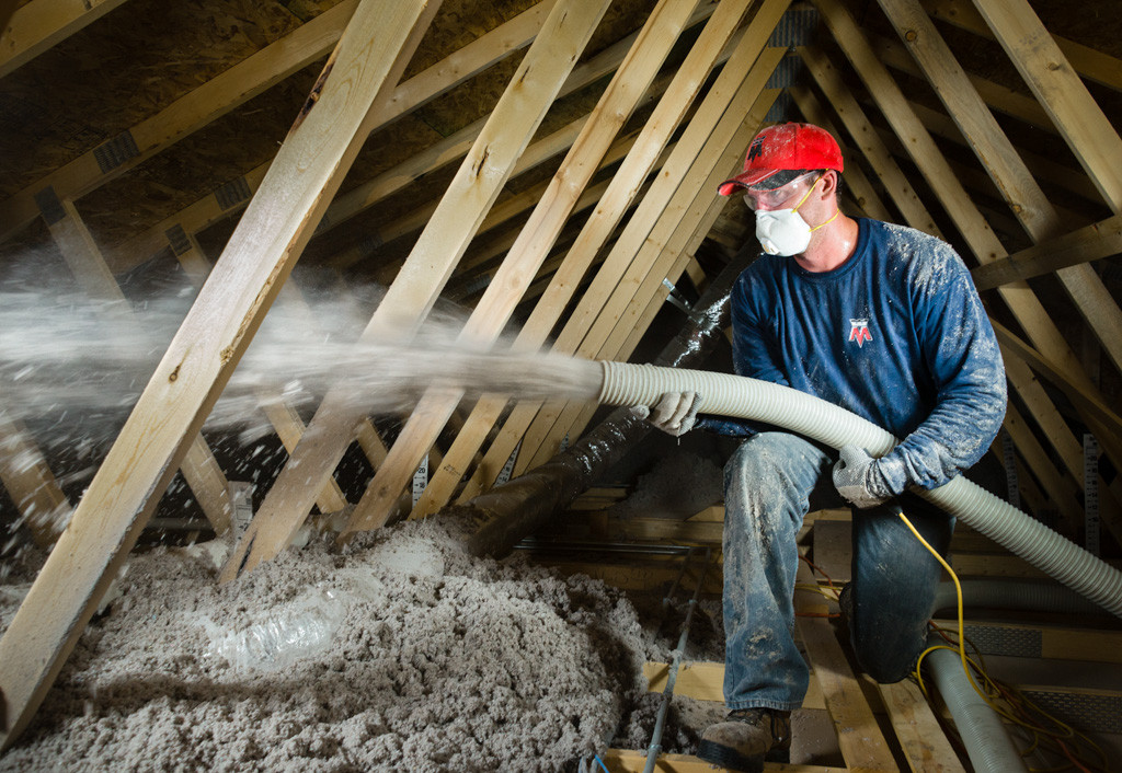 insulation being blown into attic